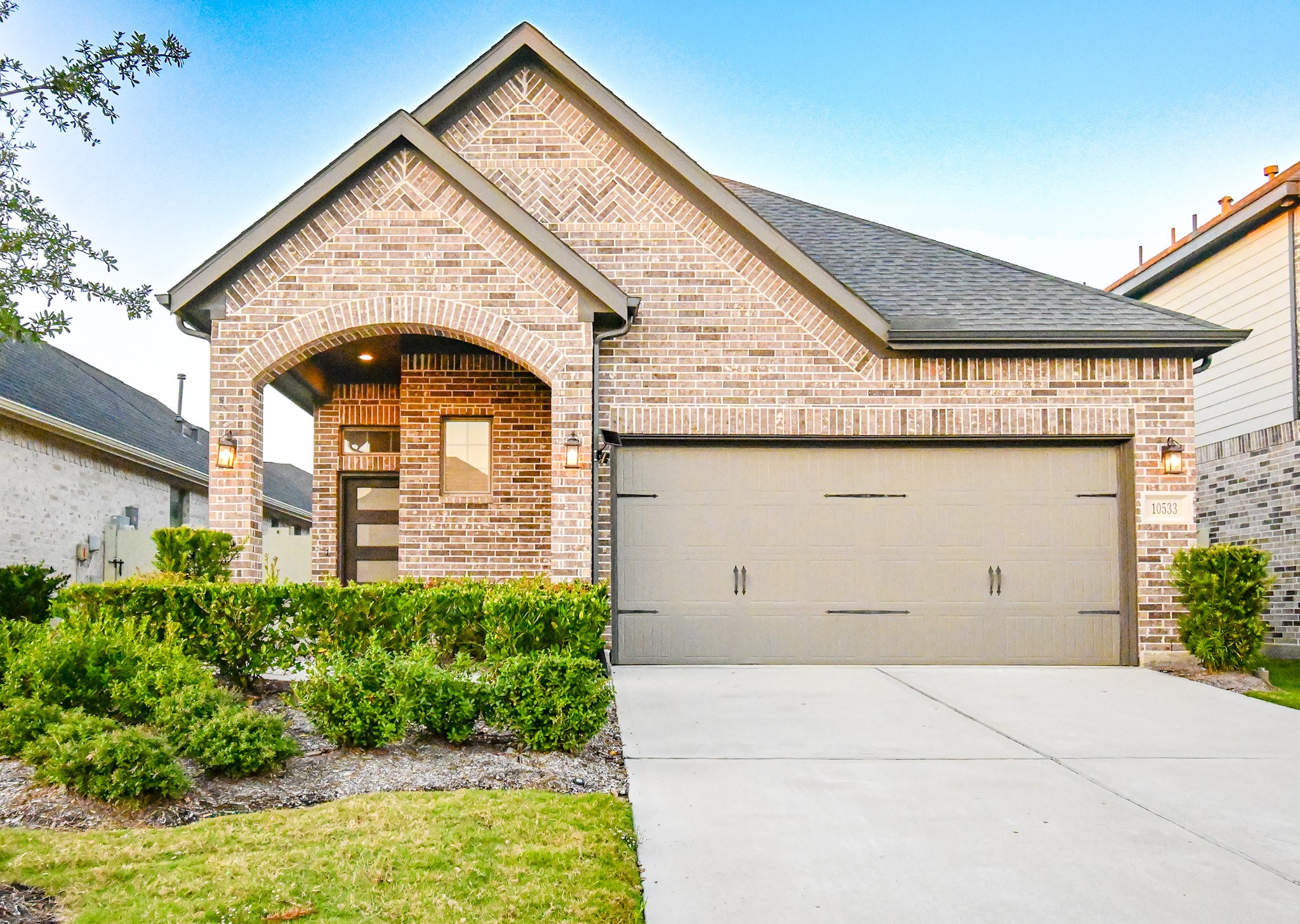 10533 Wild Chives Conroe, TX 77385 - Photo 3 of 36 a front view of a house with garden