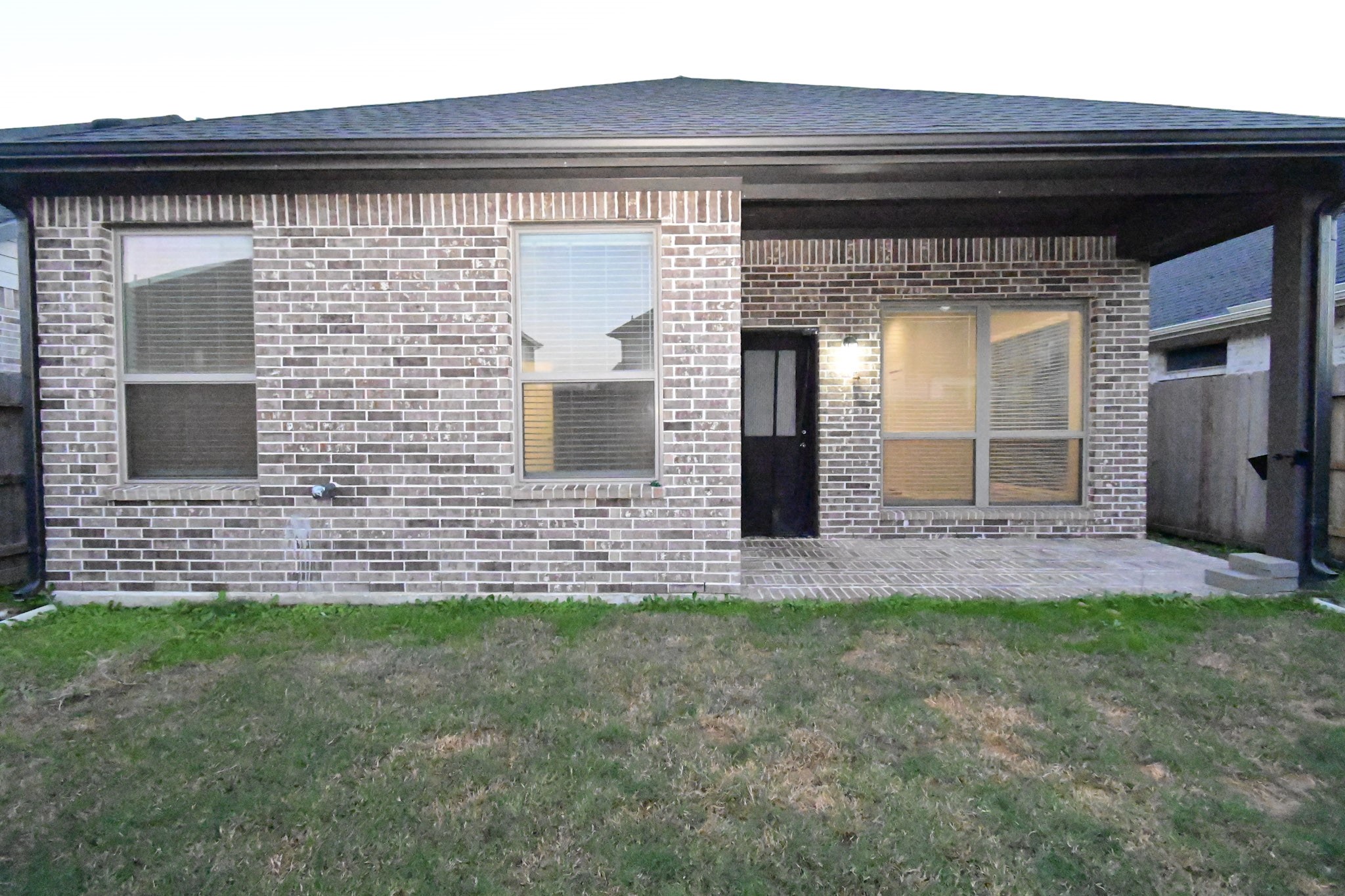 10533 Wild Chives Conroe, TX 77385 - Photo 32 of 36 a front view of a house with a yard