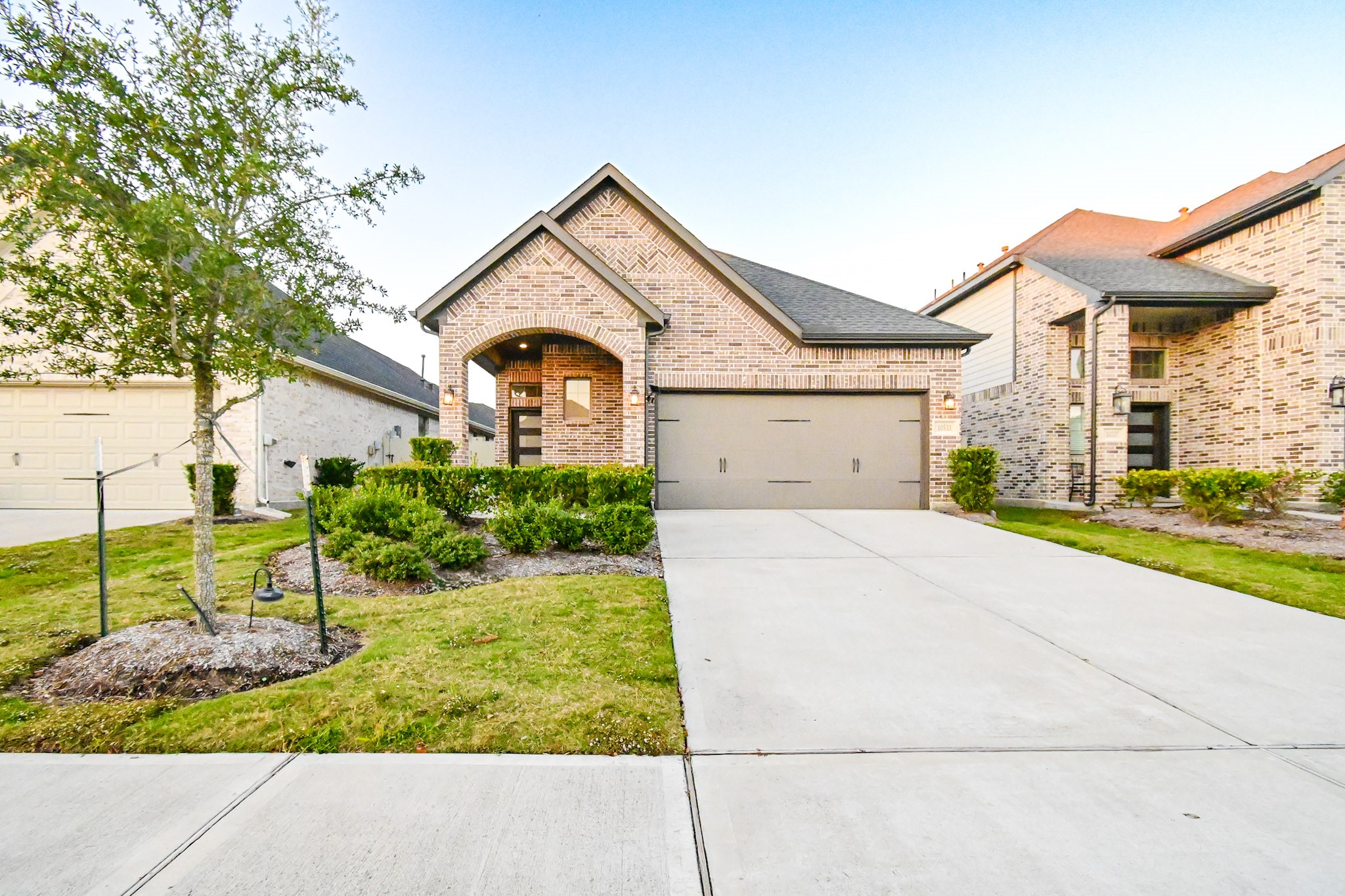10533 Wild Chives Conroe, TX 77385 - Photo 5 of 36 a front view of a house with garden
