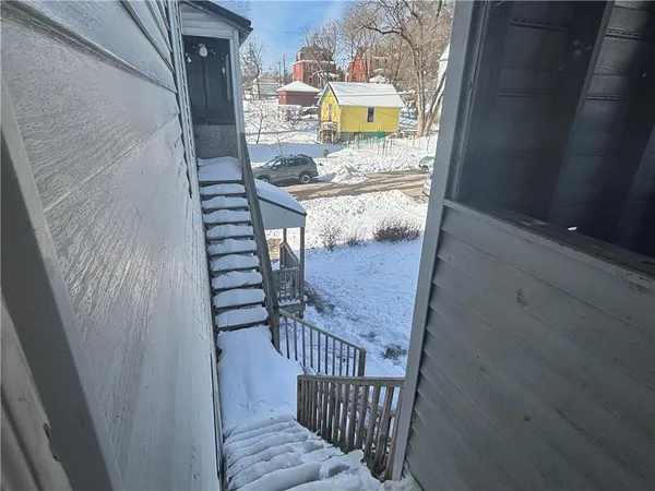 a view of balcony and wooden floor