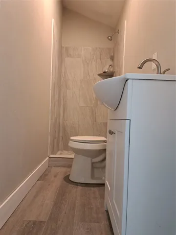a bathroom with a toilet and a sink