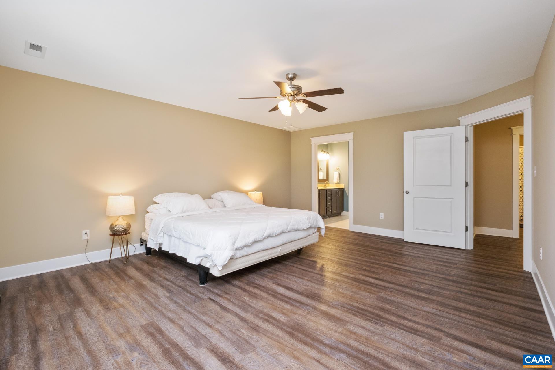103 Oakstone Run Staunton, VA 24401 - Photo 34 of 42 a bedroom with a bed and wooden floor