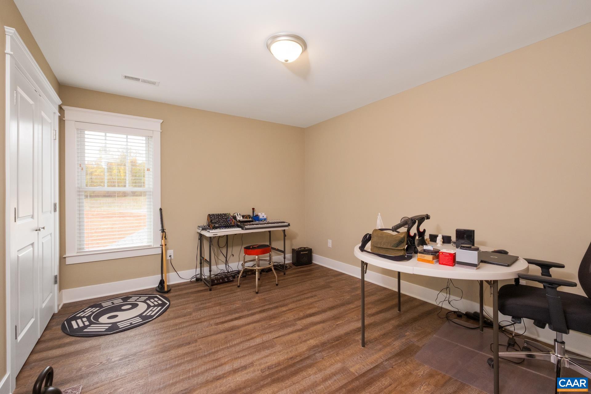 103 Oakstone Run Staunton, VA 24401 - Photo 38 of 42 a living room with furniture and a wooden floor