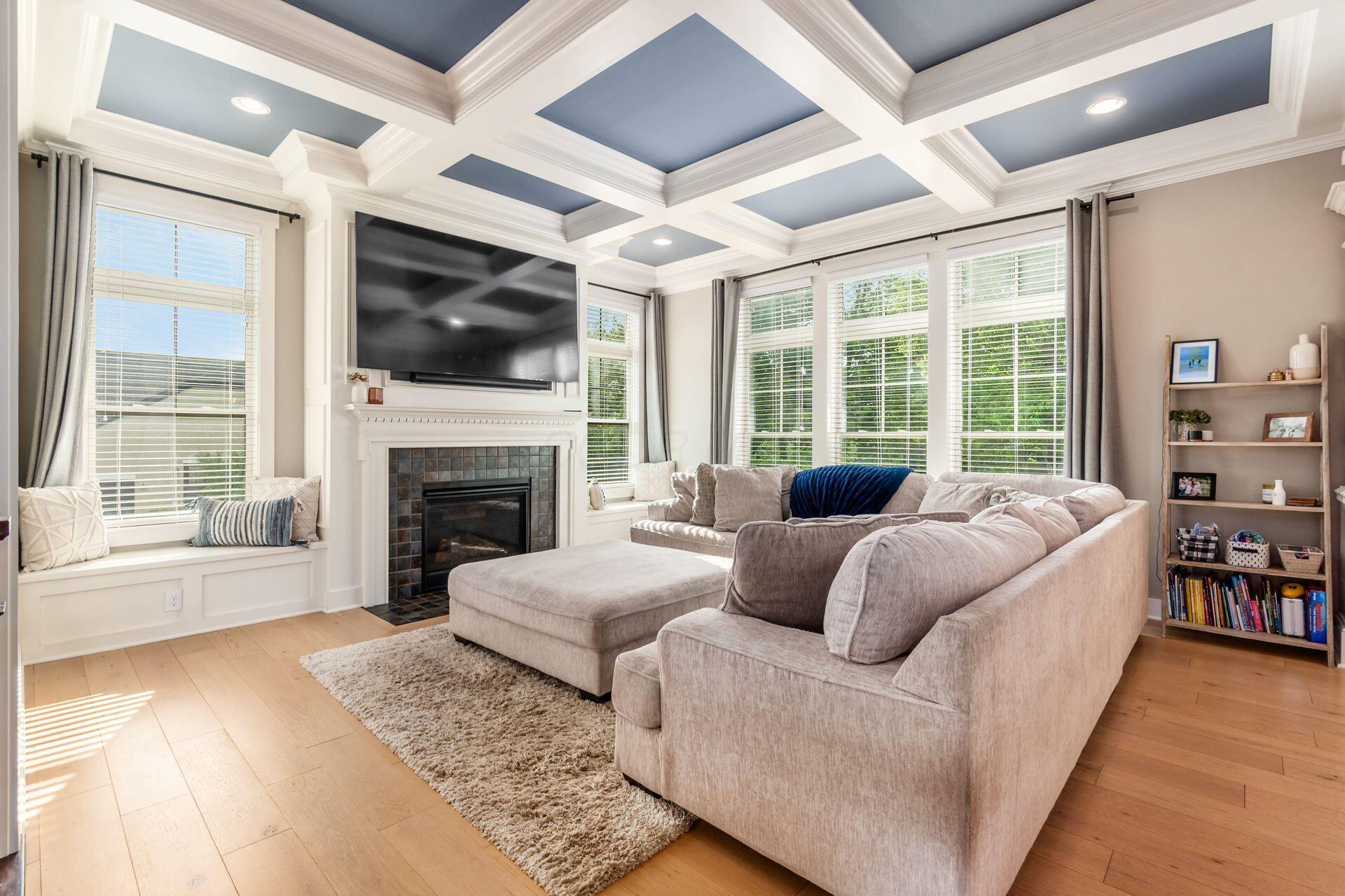 1002 Rambling Brook Way Delaware, OH 43015 - Photo 12 of 104 Spacious Great Room with coffered ceiling, window benches and gas fireplace.