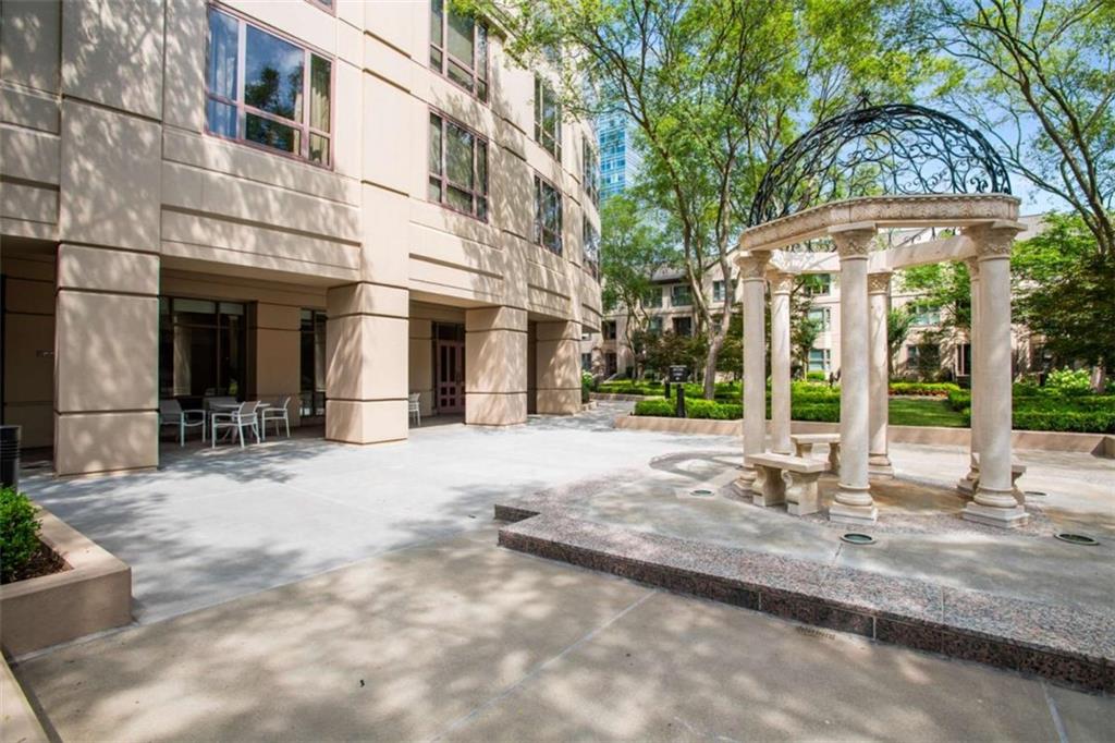 3475 Oak Valley Road Northeast, Unit 1630 Atlanta, GA 30326 - Photo 38 of 38 a view of a building with a tree