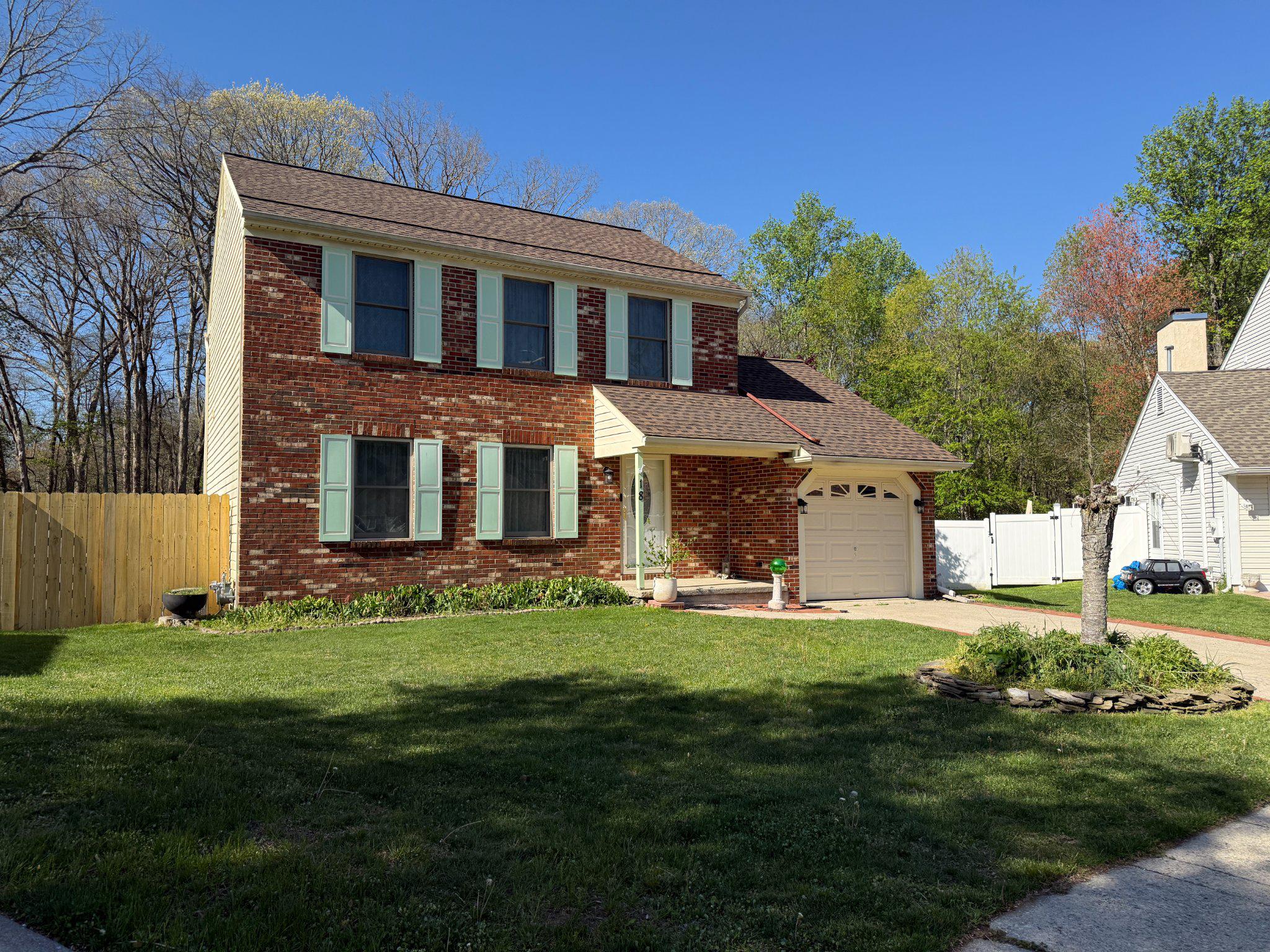 18 Cobblestone Court Sicklerville, NJ 08081 - Photo 2 of 56 a front view of a house with a yard