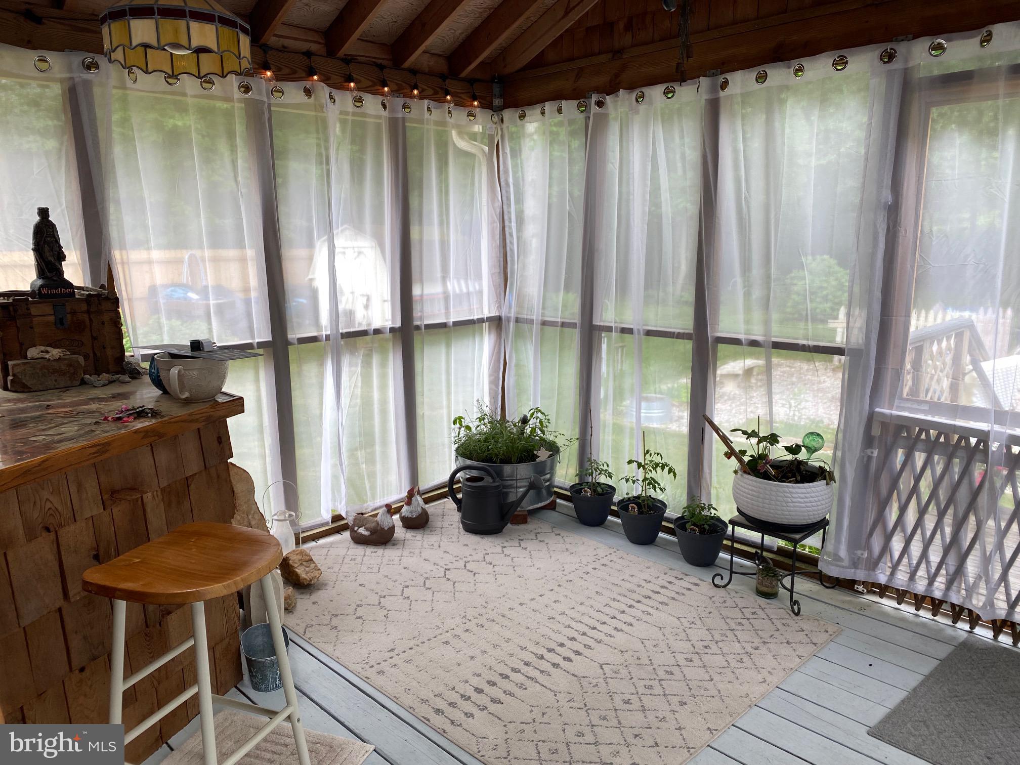 18 Cobblestone Court Sicklerville, NJ 08081 - Photo 23 of 56 a kitchen with a chair and potted plant