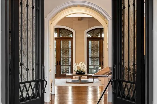 a view of balcony with two large trees