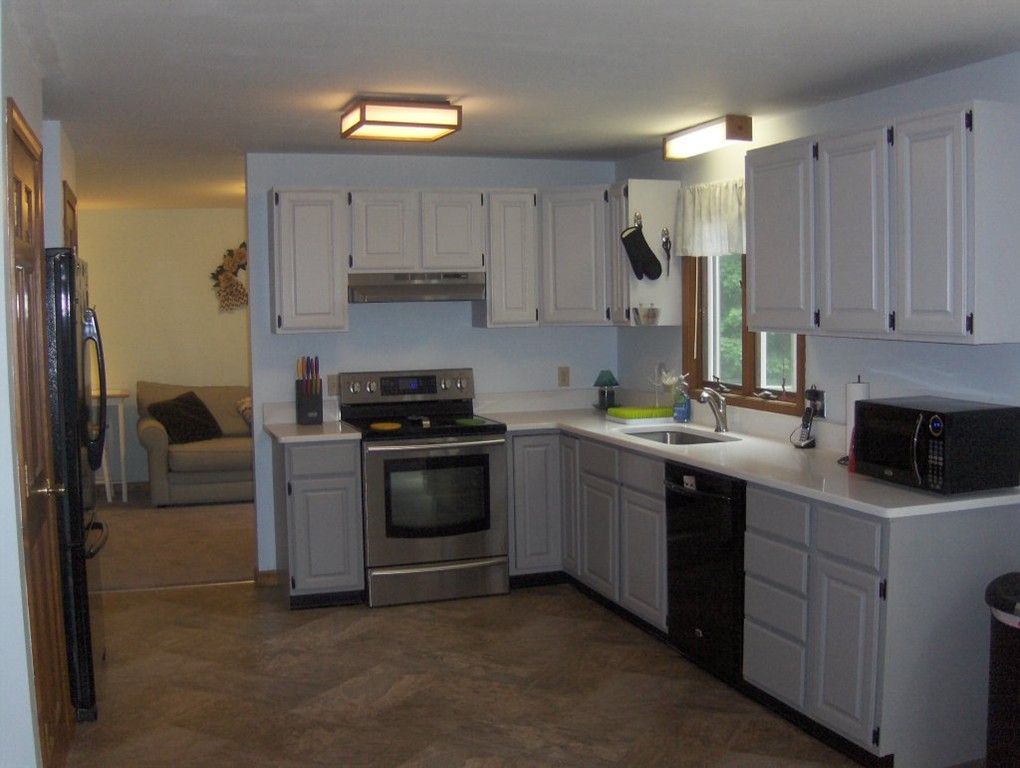 65 North Sturbridge Road Charlton, MA 01507 - Photo 2 of 30 a kitchen with a sink cabinets and stainless steel appliances