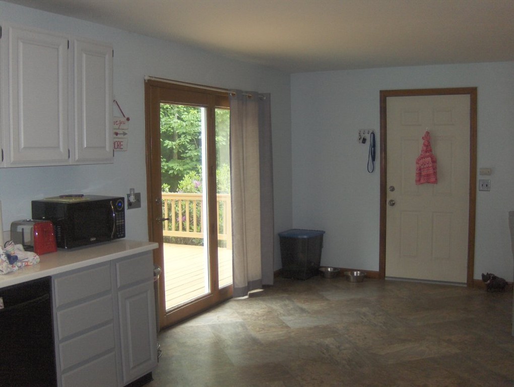 65 North Sturbridge Road Charlton, MA 01507 - Photo 4 of 30 a kitchen with a stove and a microwave