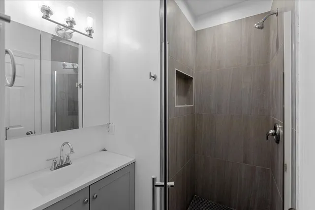 a bathroom with a sink and mirror