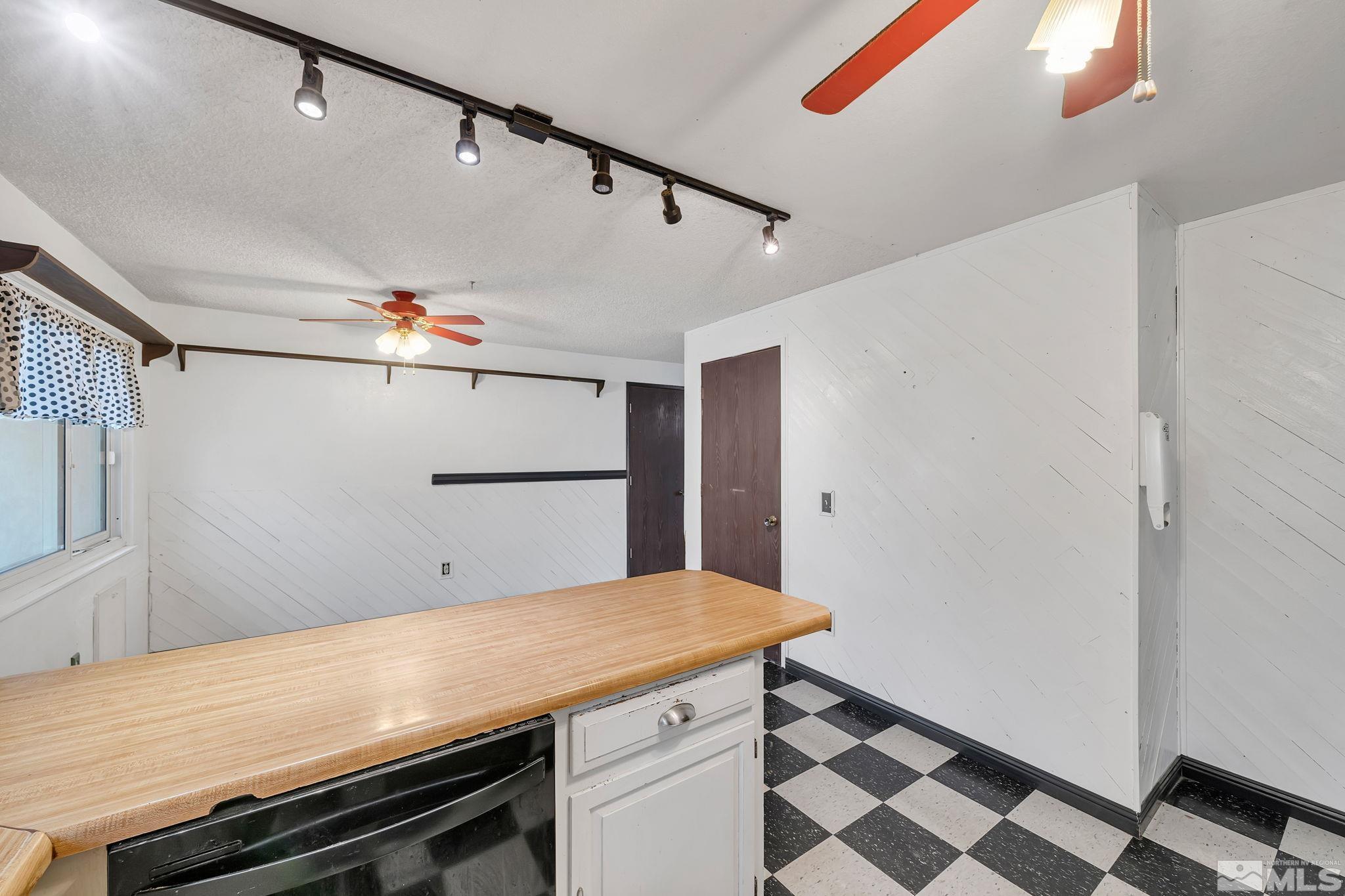 233 Ring Road Dayton, NV 89403 - Photo 12 of 39 a room with wooden cabinets and stainless steel appliances