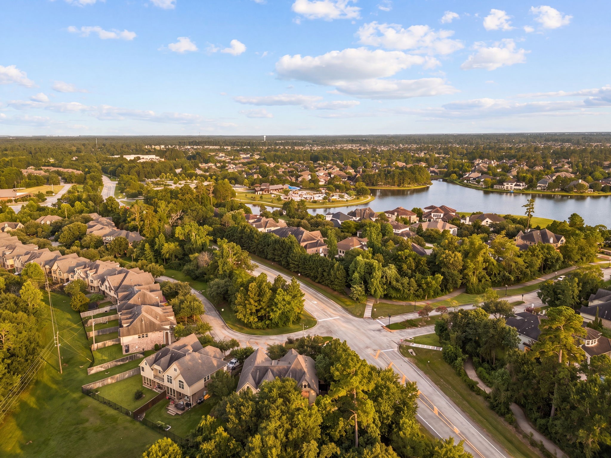 98 Herons Flight Place Spring, TX 77389 - Photo 23 of 29 Aerial perspective showcases the sought-after neighborhood, complete with scenic lake views and easy access to community amenities.