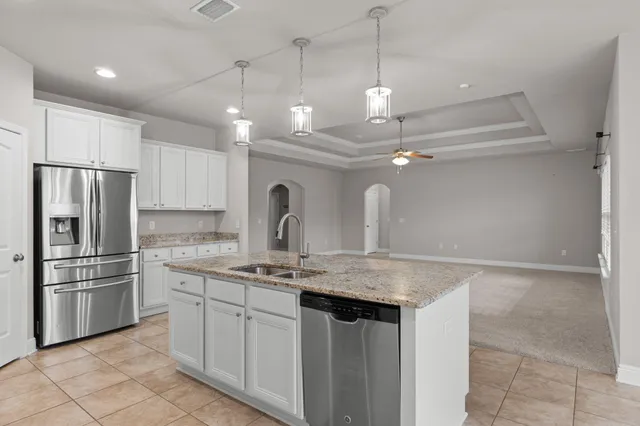 a kitchen with a refrigerator a sink and a refrigerator