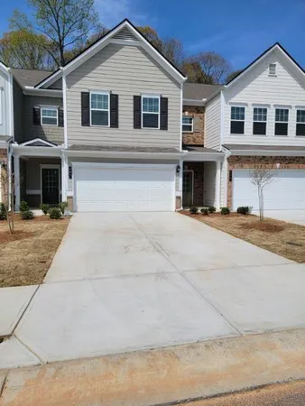 a front view of a house with yard