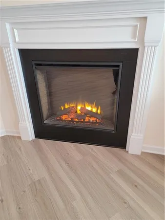 a view of fireplace and wooden floor
