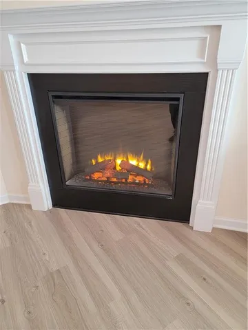 a view of fireplace and wooden floor