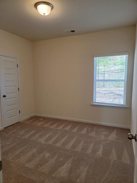 160 Madison Bend Holly Springs, GA 30115 - Photo 6 of 15 an empty room with a window