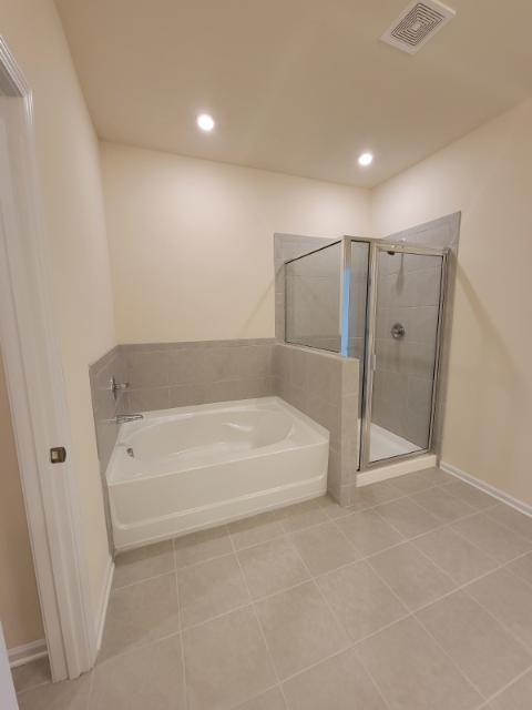 160 Madison Bend Holly Springs, GA 30115 - Photo 7 of 15 a spacious bathroom with a bathtub and shower