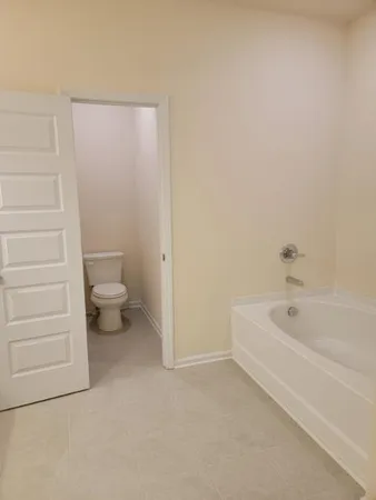 a bathroom with a toilet a sink and a bathtub