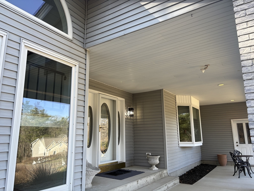 321 Westerly Circle Ludlow, MA 01056 - Photo 14 of 38 a front view of a house with a glass door