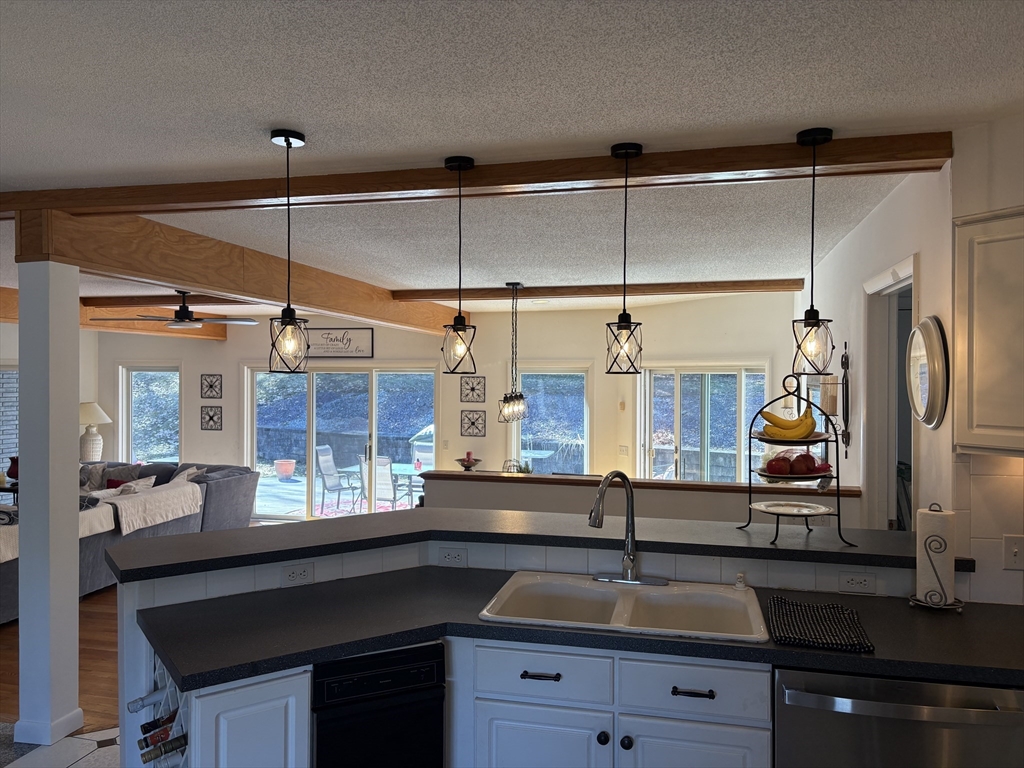 321 Westerly Circle Ludlow, MA 01056 - Photo 16 of 38 a kitchen with a sink and a refrigerator