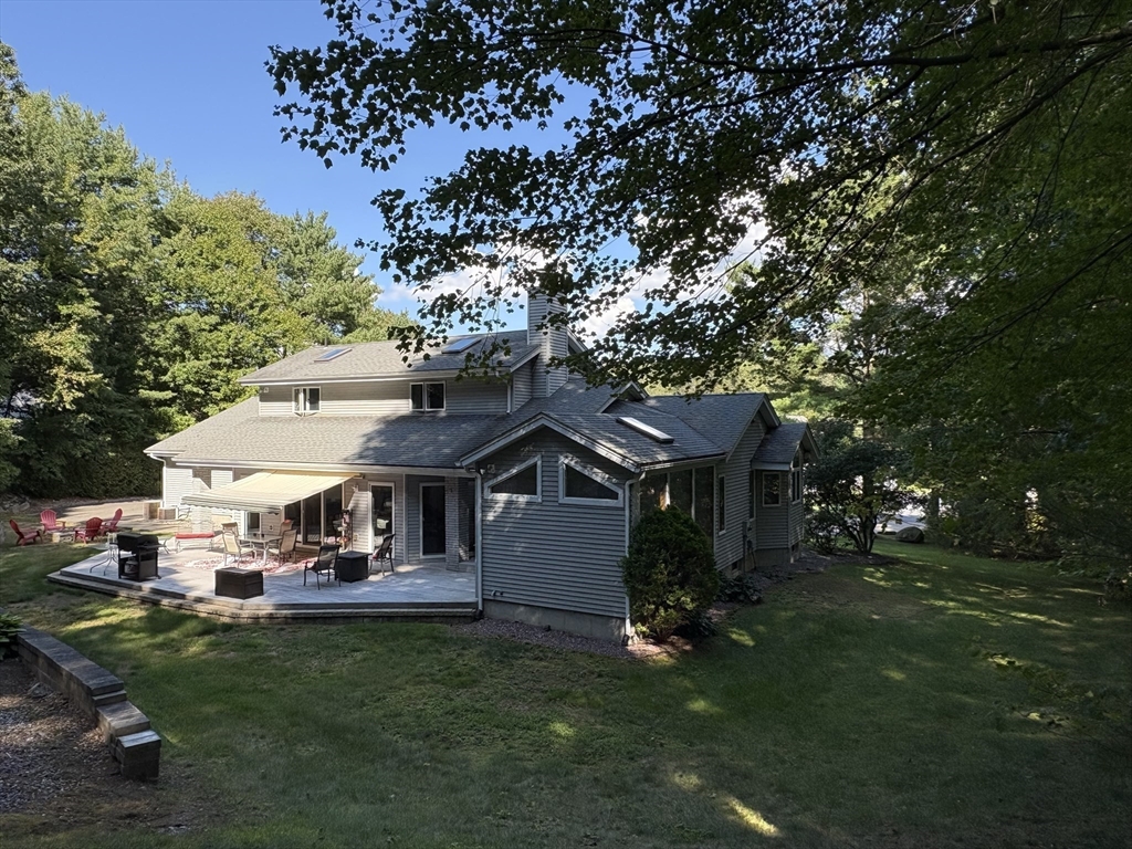 321 Westerly Circle Ludlow, MA 01056 - Photo 2 of 38 a front view of a house with a garden