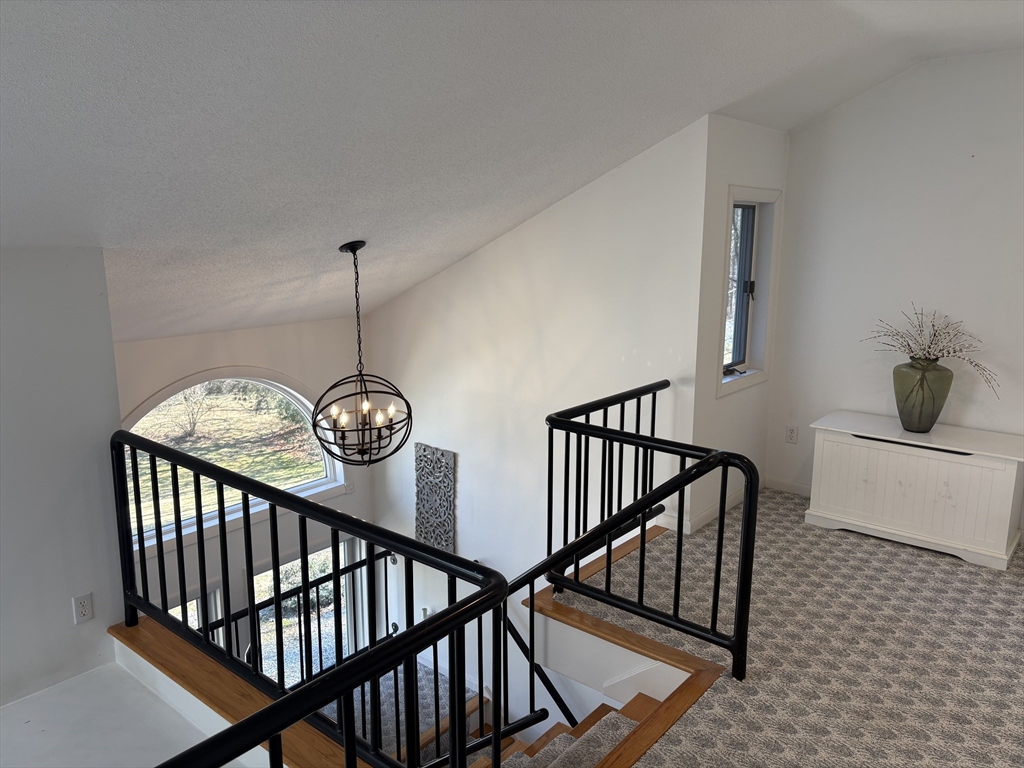 321 Westerly Circle Ludlow, MA 01056 - Photo 22 of 38 a view of entryway with wooden floor and stairs