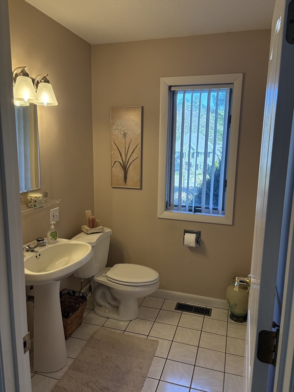 321 Westerly Circle Ludlow, MA 01056 - Photo 24 of 38 a bathroom with a sink toilet and mirror