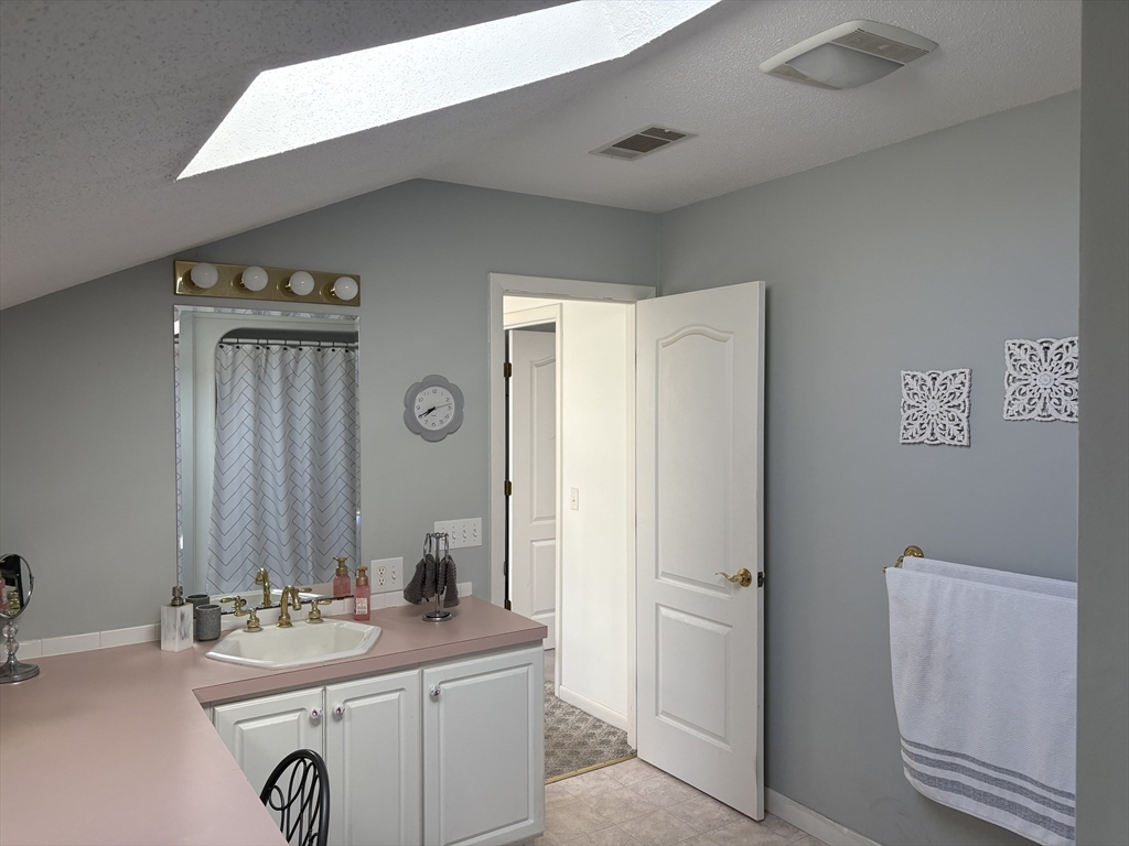 321 Westerly Circle Ludlow, MA 01056 - Photo 27 of 38 a bathroom with a sink a toilet and a mirror