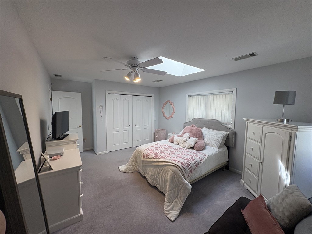 321 Westerly Circle Ludlow, MA 01056 - Photo 29 of 38 a bedroom with a bed furniture and a flat screen tv