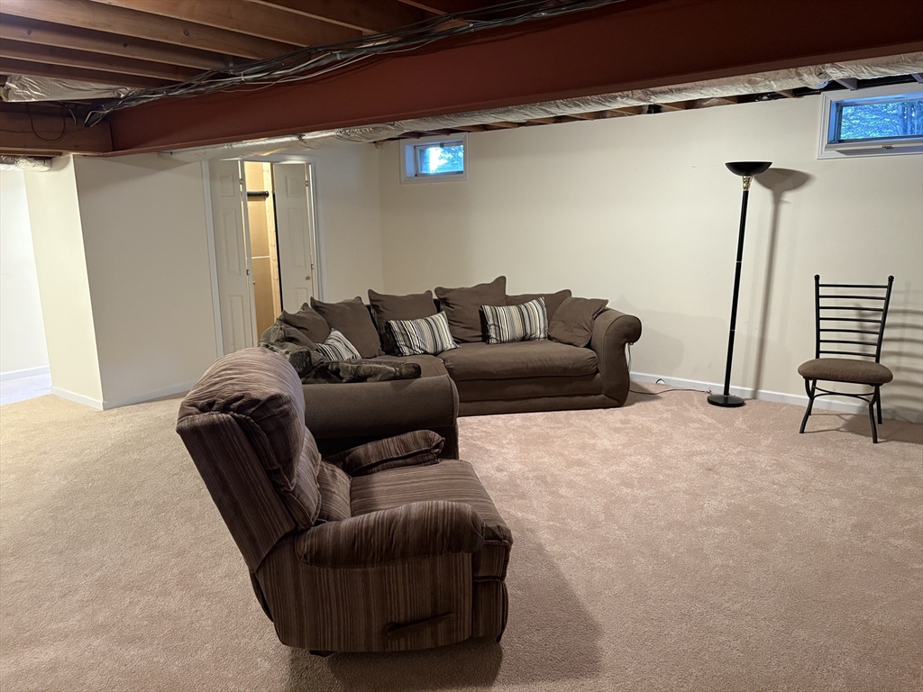 321 Westerly Circle Ludlow, MA 01056 - Photo 34 of 38 a living room with furniture and a wooden floor
