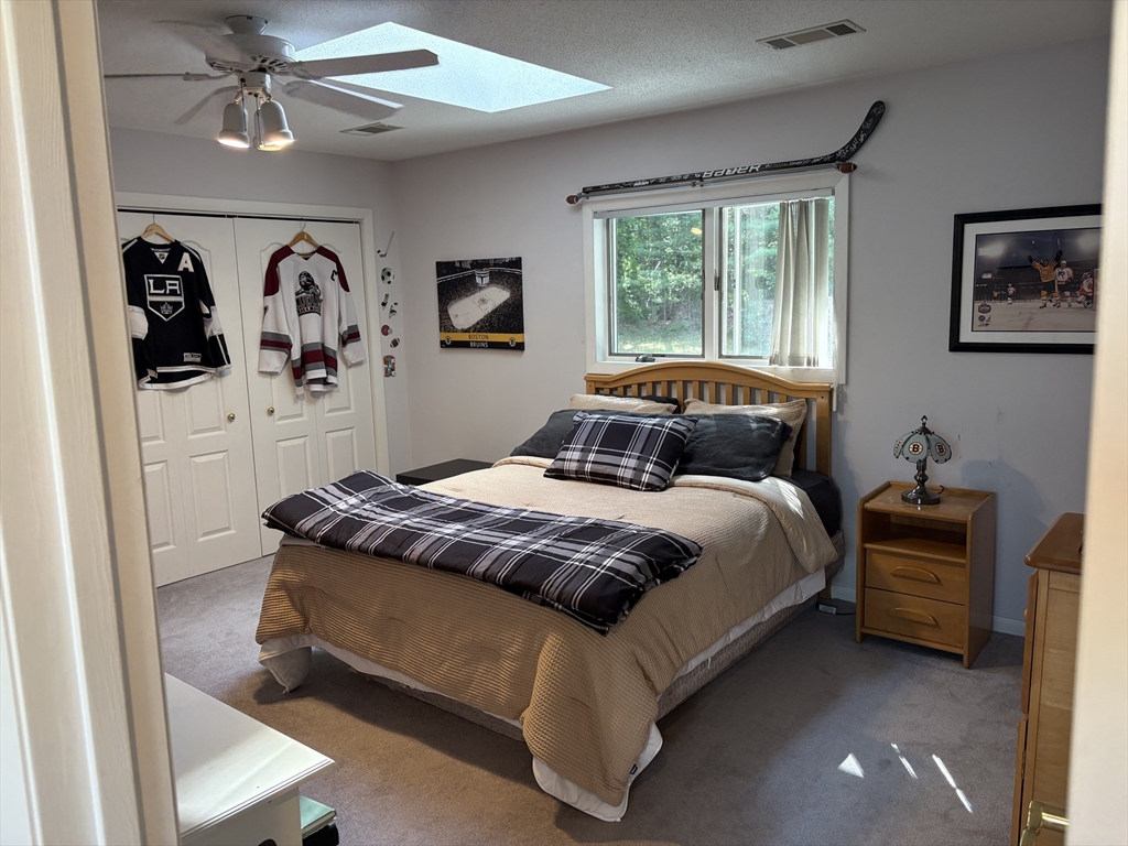 321 Westerly Circle Ludlow, MA 01056 - Photo 35 of 38 a bedroom with a large bed and a window