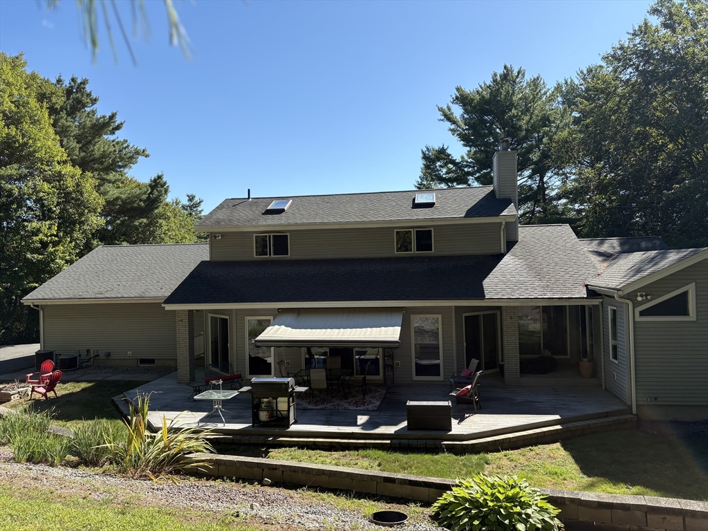 321 Westerly Circle Ludlow, MA 01056 - Photo 38 of 38 a front view of a house with swimming pool and chairs