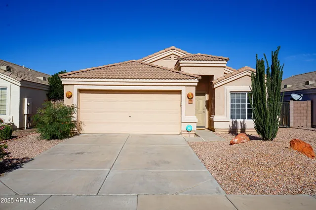 a front view of a house with a outdoor space