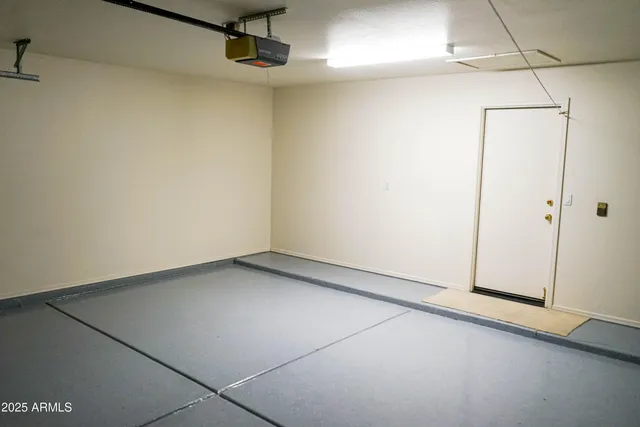 a view of a house with a yard and garage