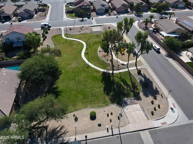 a view of a park with swings and slides