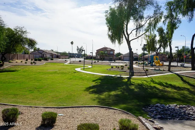 a view of a park with swings and slides