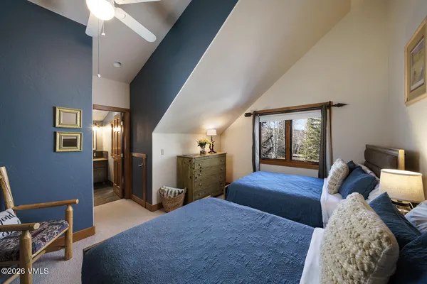 a bed room with a bed and a mirror