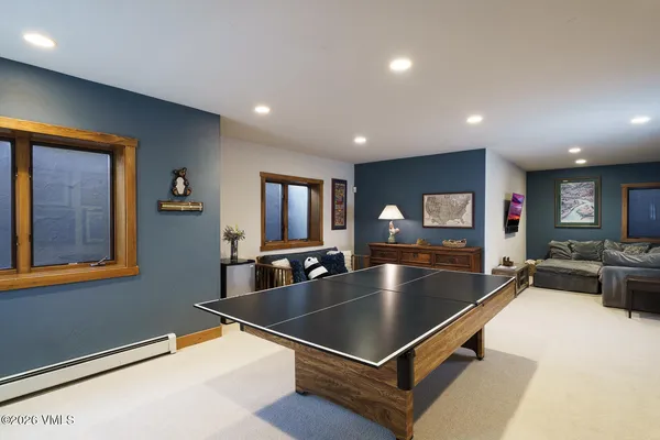 a pool table sitting in the middle of a room