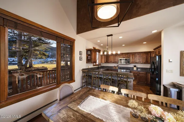 a kitchen with a table and chairs in it