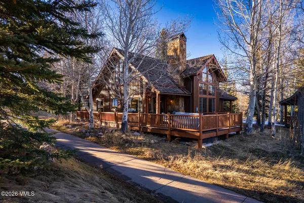 a front view of a house with a yard fountain