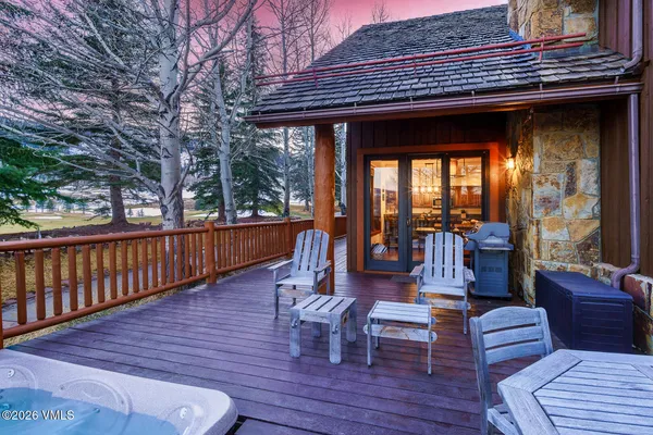 a view of a deck with couches table and chairs