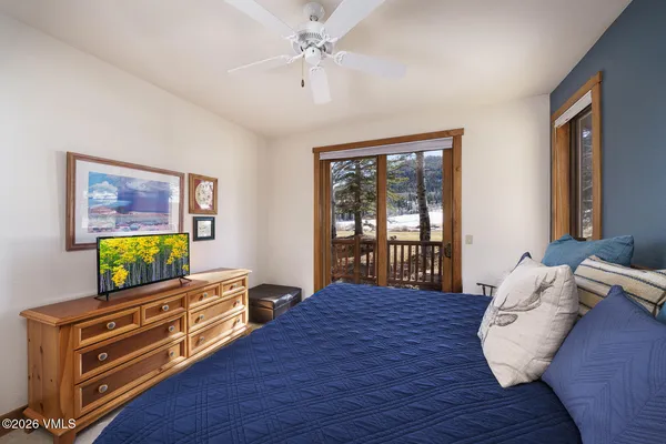 a bed room with bed and window