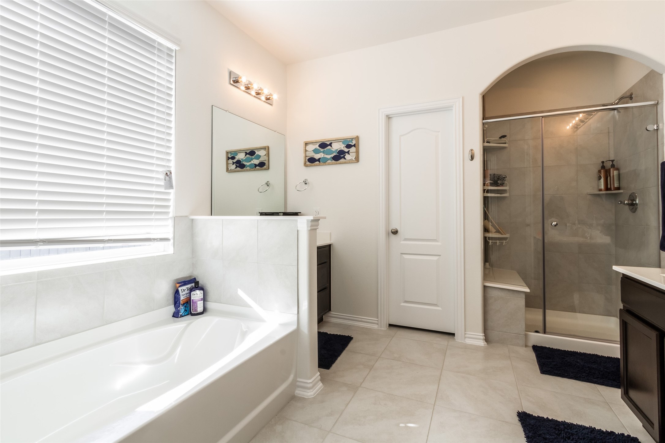 6305 Rotherham Street League City, TX 77573 - Photo 19 of 22 a bathroom with a bathtub and a shower
