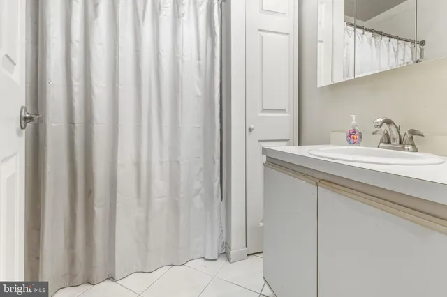 a bathroom with a sink and a cabinets