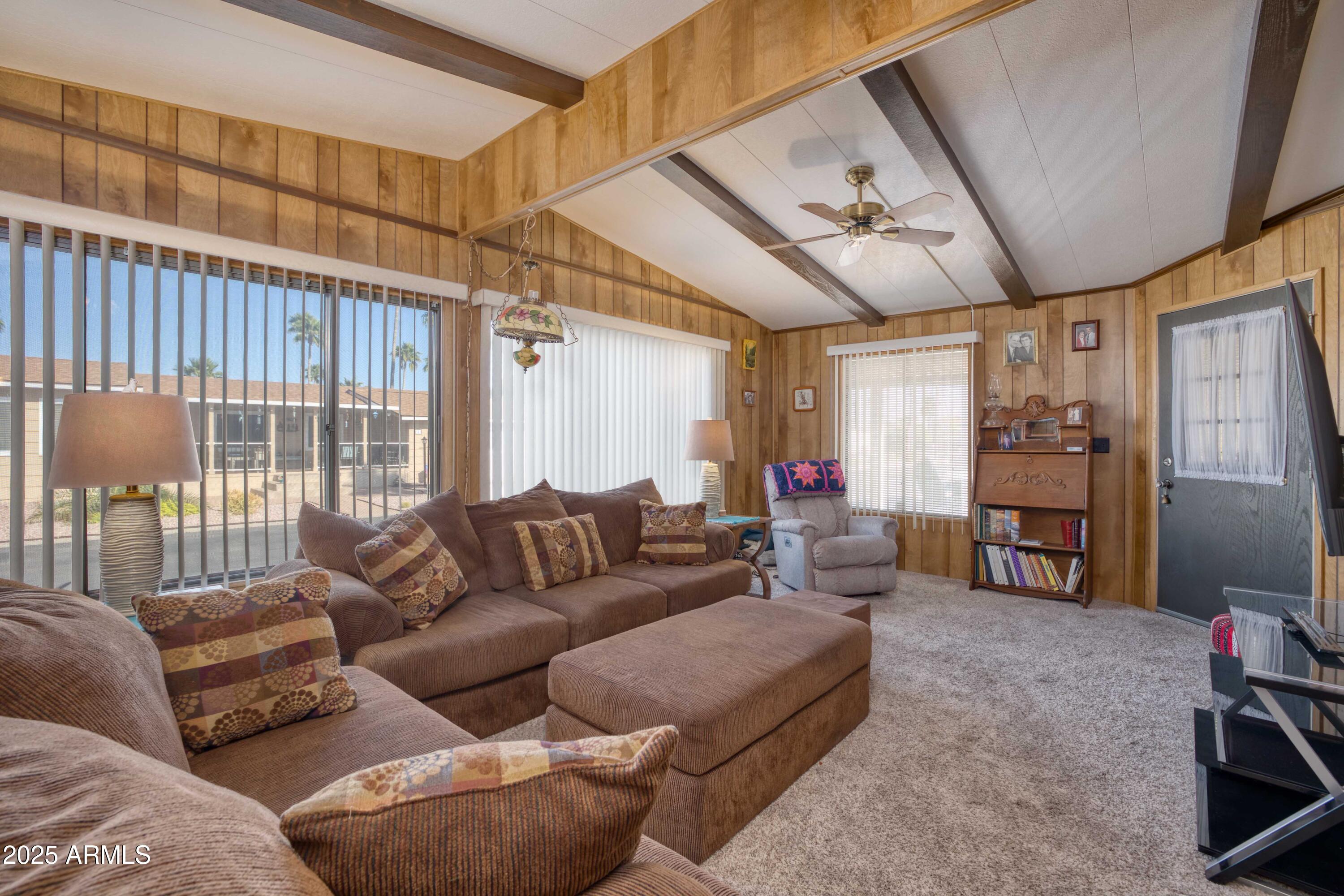 9302 East Broadway Road, Unit 185 Mesa, AZ 85208 - Photo 11 of 24 a living room with furniture and a flat screen tv