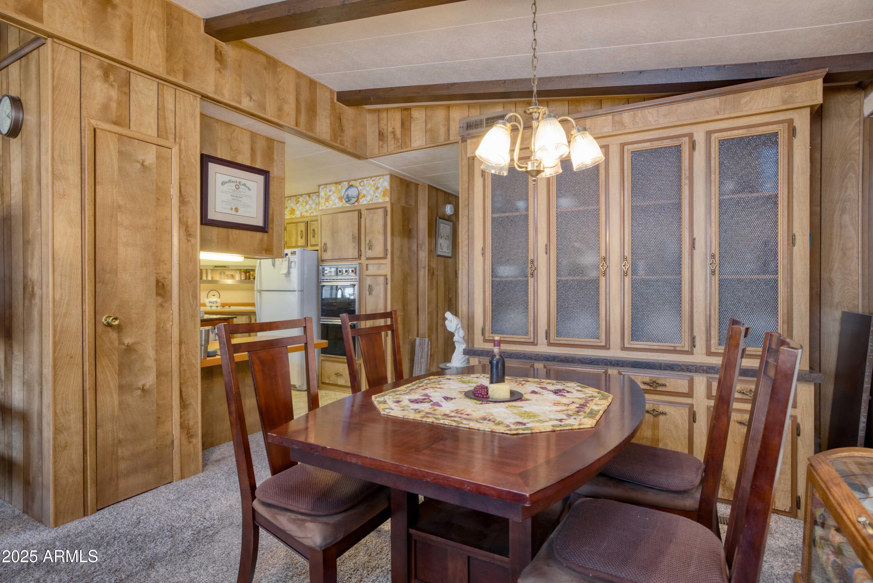 9302 East Broadway Road, Unit 185 Mesa, AZ 85208 - Photo 13 of 24 a view of a dining room with furniture and window