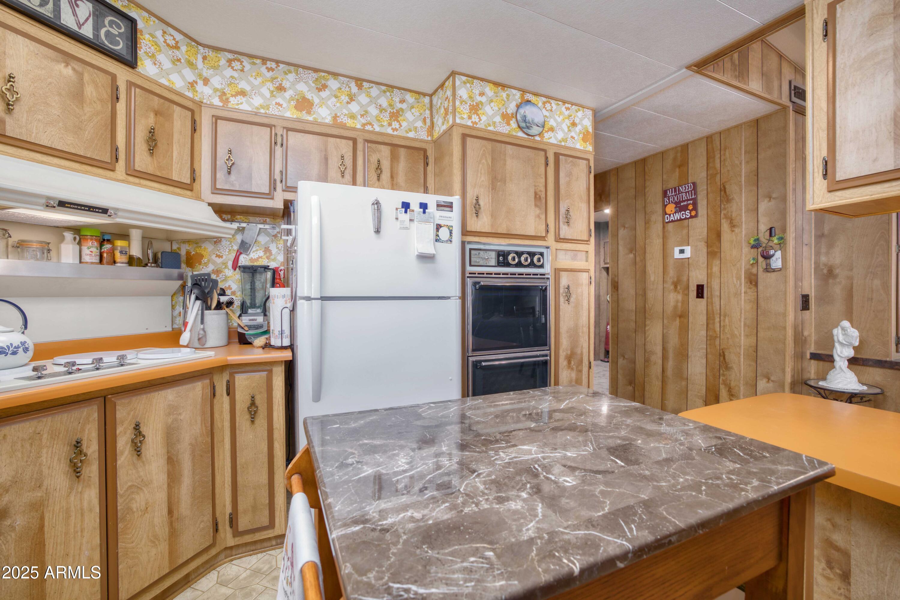 9302 East Broadway Road, Unit 185 Mesa, AZ 85208 - Photo 16 of 24 a kitchen with stainless steel appliances granite countertop a refrigerator a oven and a sink