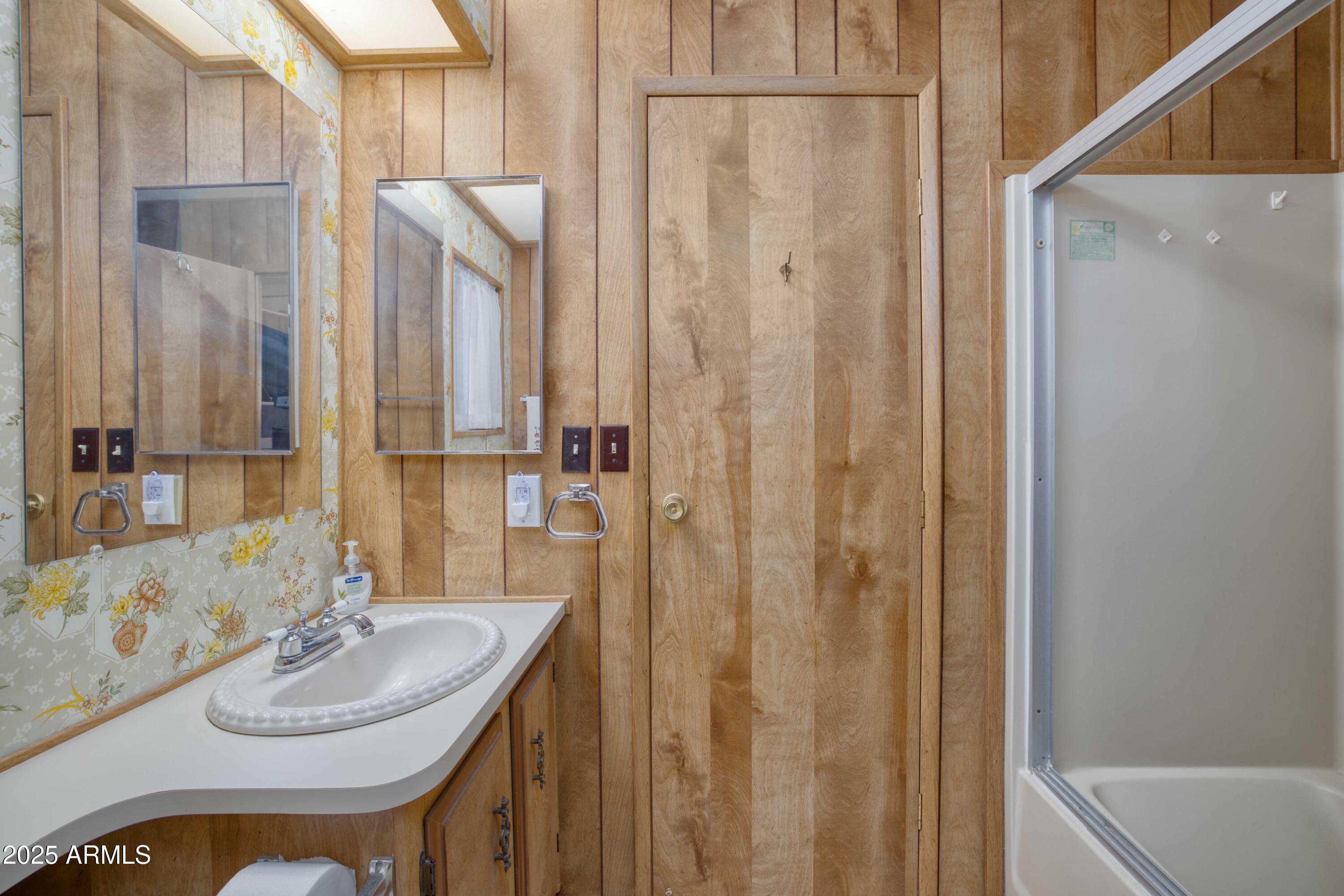 9302 East Broadway Road, Unit 185 Mesa, AZ 85208 - Photo 20 of 24 a bathroom with a sink and a mirror